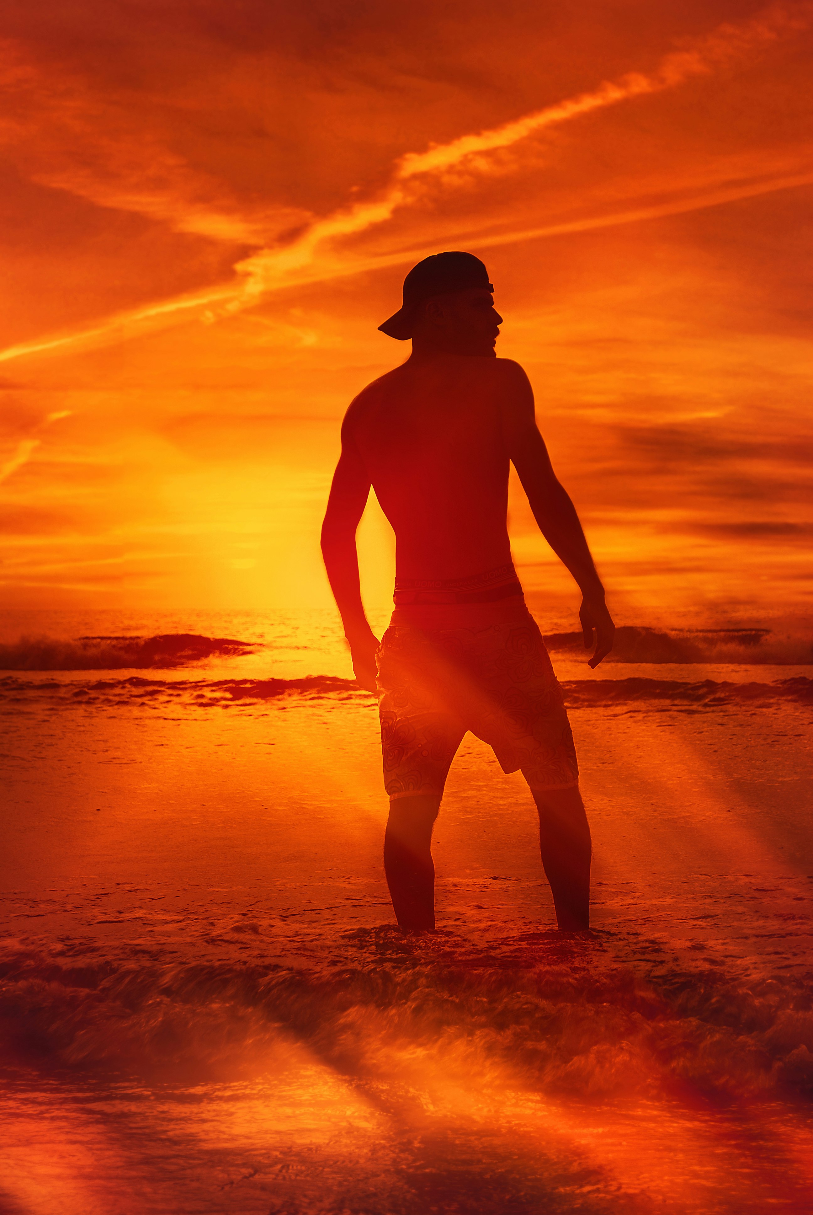 man standing in beach shore